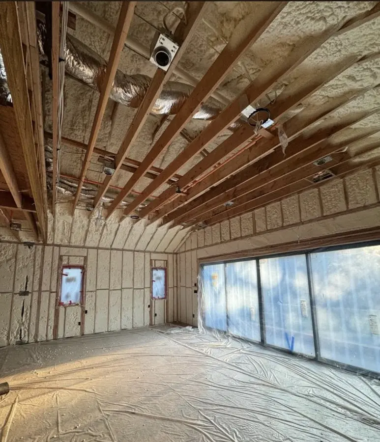 Interior walls and ceiling insulated with spray foam during new construction in Northfield